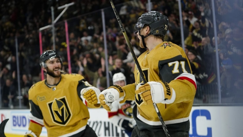 Jan 12, 2023; Las Vegas, Nevada, USA;  Vegas Golden Knights center William Karlsson (71) celebrates with center Nicolas Roy (10) after scoring an empty net goal against the Florida Panthers during the third period at T-Mobile Arena. Mandatory Credit: Lucas Peltier-USA TODAY Sports