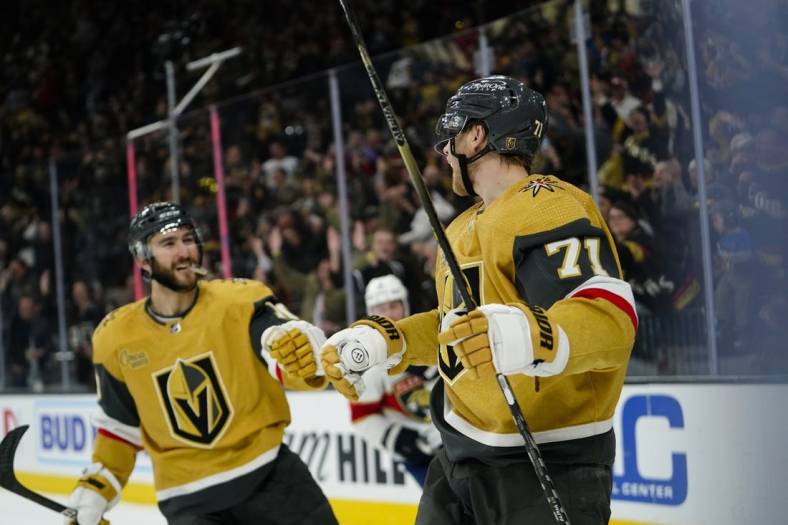Jan 12, 2023; Las Vegas, Nevada, USA;  Vegas Golden Knights center William Karlsson (71) celebrates with center Nicolas Roy (10) after scoring an empty net goal against the Florida Panthers during the third period at T-Mobile Arena. Mandatory Credit: Lucas Peltier-USA TODAY Sports