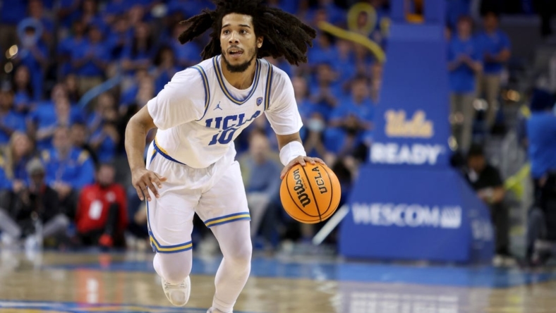 Jan 12, 2023; Los Angeles, California, USA;  UCLA Bruins guard Tyger Campbell (10) dribbles the ball during the second half against the Utah Utes at Pauley Pavilion presented by Wescom. Mandatory Credit: Kiyoshi Mio-USA TODAY Sports