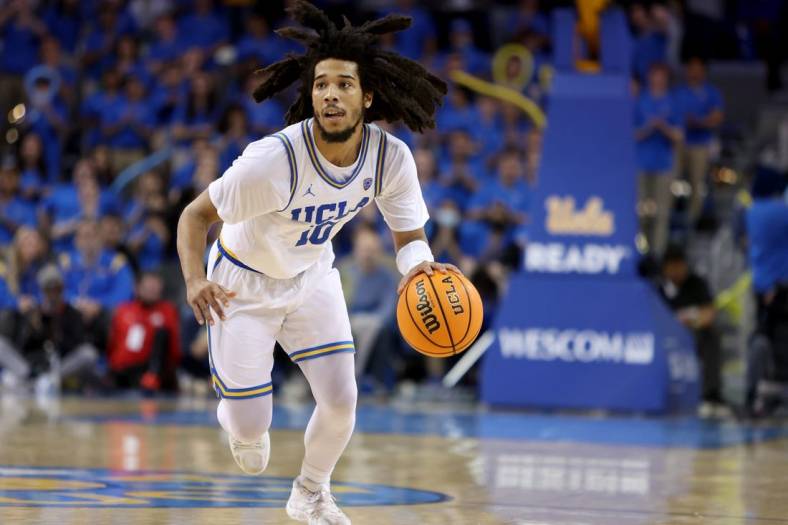 Jan 12, 2023; Los Angeles, California, USA;  UCLA Bruins guard Tyger Campbell (10) dribbles the ball during the second half against the Utah Utes at Pauley Pavilion presented by Wescom. Mandatory Credit: Kiyoshi Mio-USA TODAY Sports