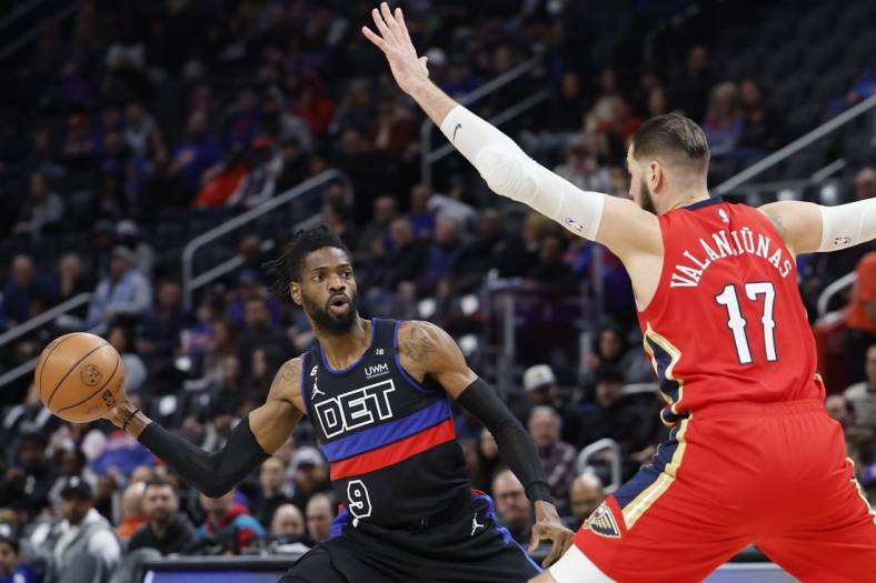 Jan 13, 2023; Detroit, Michigan, USA;  Detroit Pistons guard Nerlens Noel (9) passes defended by New Orleans Pelicans center Jonas Valanciunas (17) in the first half at Little Caesars Arena. Mandatory Credit: Rick Osentoski-USA TODAY Sports