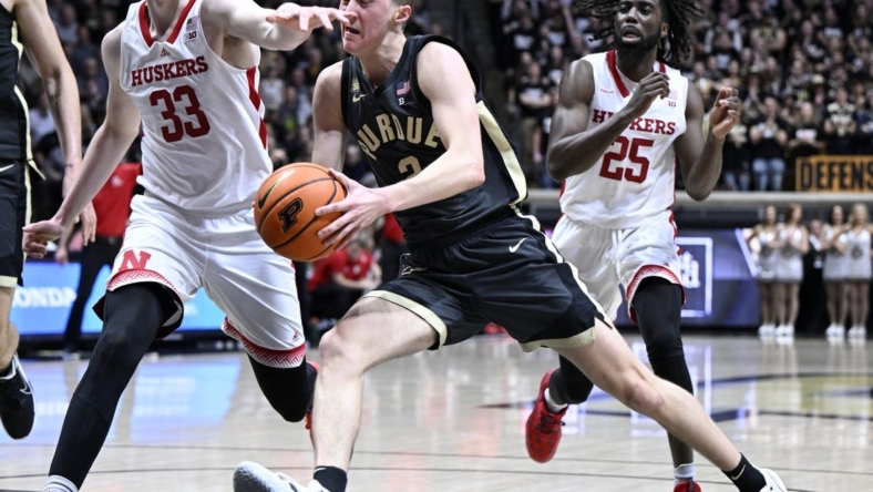 Jan 13, 2023; West Lafayette, Indiana, USA; Purdue Boilermakers guard Fletcher Loyer (2) runs into Nebraska Cornhuskers forward Oleg Kojenets (33) while driving toward the basket during the second half at Mackey Arena. Boilermakers won 73 to 55. Mandatory Credit: Marc Lebryk-USA TODAY Sports