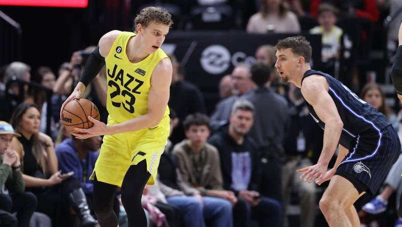 Jan 13, 2023; Salt Lake City, Utah, USA; Utah Jazz forward Lauri Markkanen (23) looks to move that ball against Orlando Magic forward Franz Wagner (22) in the first quarter at Vivint Arena. Mandatory Credit: Rob Gray-USA TODAY Sports