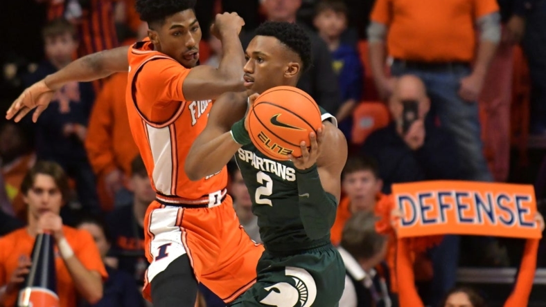 Jan 13, 2023; Champaign, Illinois, USA;  Michigan State Spartans guard Tyson Walker (2) looks to pass as Illinois Fighting Illini guard Sencire Harris (1) defends during the first half at State Farm Center. Mandatory Credit: Ron Johnson-USA TODAY Sports