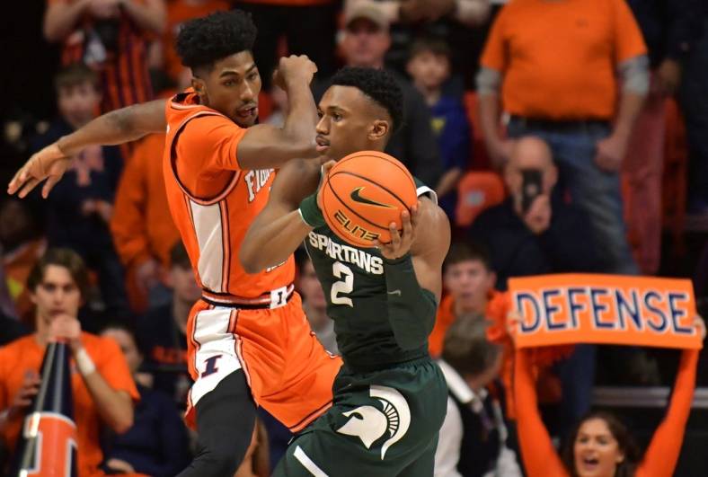 Jan 13, 2023; Champaign, Illinois, USA;  Michigan State Spartans guard Tyson Walker (2) looks to pass as Illinois Fighting Illini guard Sencire Harris (1) defends during the first half at State Farm Center. Mandatory Credit: Ron Johnson-USA TODAY Sports
