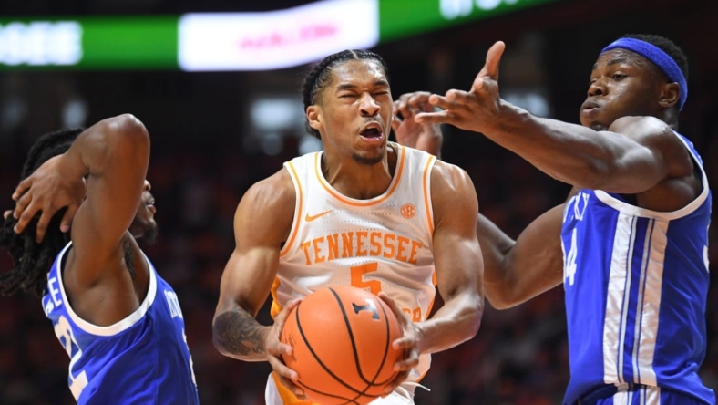 Tennessee guard Zakai Zeigler (5) takes a shot while defended during a game between the Tennessee Vols and the Kentucky Wildcats, in Thompson-Boling Arena, in Knoxville, Tenn., Saturday, Jan. 14, 2023.

Volskentucky0114 0589