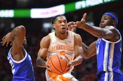 Tennessee guard Zakai Zeigler (5) takes a shot while defended during a game between the Tennessee Vols and the Kentucky Wildcats, in Thompson-Boling Arena, in Knoxville, Tenn., Saturday, Jan. 14, 2023.

Volskentucky0114 0589