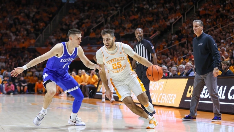 Jan 14, 2023; Knoxville, Tennessee, USA; Tennessee Volunteers guard Santiago Vescovi (25) moves the ball against Kentucky Wildcats guard CJ Fredrick (1) during the first half at Thompson-Boling Arena. Mandatory Credit: Randy Sartin-USA TODAY Sports