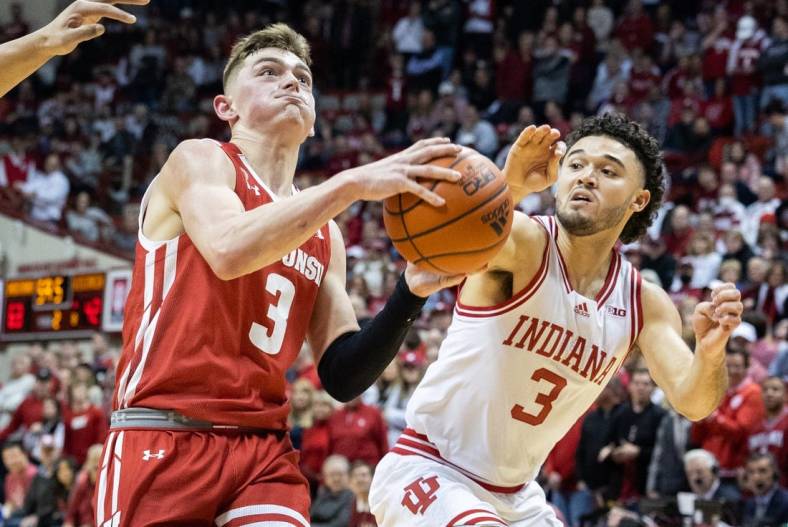 Jan 14, 2023; Bloomington, Indiana, USA; Wisconsin Badgers guard Connor Essegian (3) shoots the ball against Indiana Hoosiers guard Anthony Leal (3) in the second half at Simon Skjodt Assembly Hall. Mandatory Credit: Trevor Ruszkowski-USA TODAY Sports