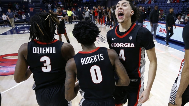 Jan 14, 2023; Oxford, Mississippi, USA; Georgia Bulldogs guard Jusaun Holt (4) reacts with Georgia Bulldogs guard Kario Oquendo (3) and Georgia Bulldogs guard Terry Roberts (0) after defeating the Mississippi Rebels at The Sandy and John Black Pavilion at Ole Miss. Mandatory Credit: Petre Thomas-USA TODAY Sports