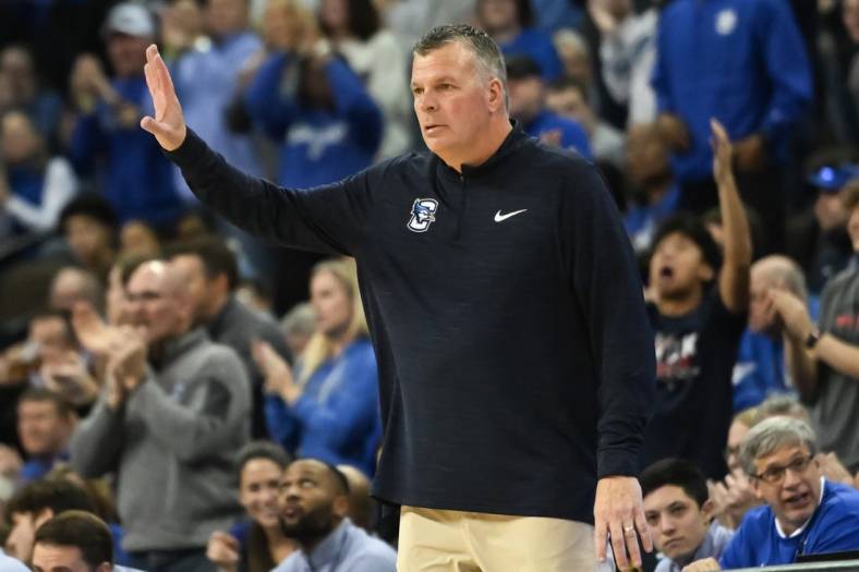 Jan 14, 2023; Omaha, Nebraska, USA;  Creighton Bluejays head coach Greg McDermott signals the team during the game against the Providence Friars in the second half at CHI Health Center Omaha. Mandatory Credit: Steven Branscombe-USA TODAY Sports