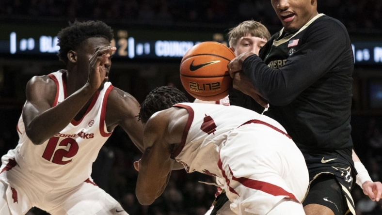 Jan 14, 2023; Nashville, Tennessee, USA;   Arkansas Razorbacks guard Davonte Davis (4) tries to take the ball from Vanderbilt Commodores guard Tyrin Lawrence (0) during the second half at Memorial Gymnasium. Mandatory Credit: George Walker IV - USA TODAY Sports