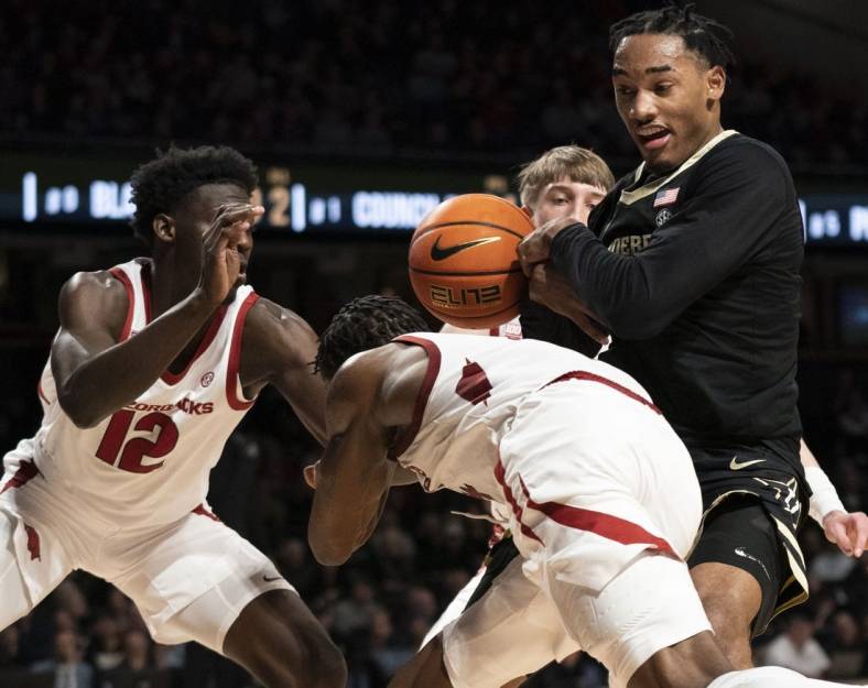 Jan 14, 2023; Nashville, Tennessee, USA;   
Arkansas Razorbacks guard Davonte Davis (4) tries to take the ball from Vanderbilt Commodores guard Tyrin Lawrence (0) during the second half at Memorial Gymnasium. Mandatory Credit: George Walker IV - USA TODAY Sports