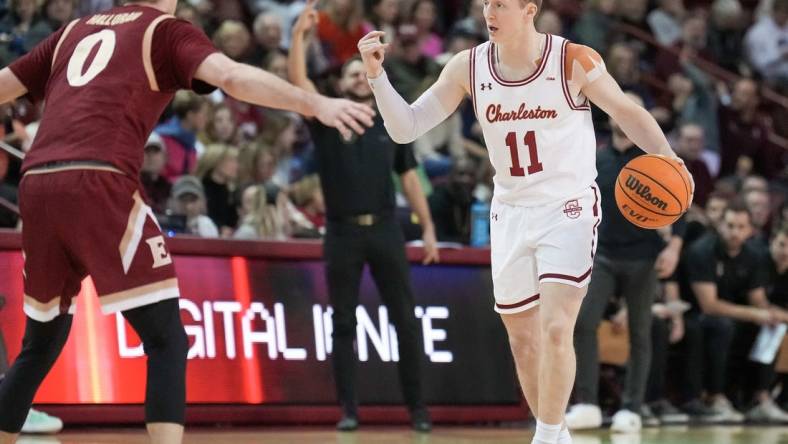 Jan 14, 2023; Charleston, South Carolina, USA; Charleston Cougars guard Ryan Larson (11) directs traffic in the first half against the Elon Phoenix at TD Arena. Mandatory Credit: David Yeazell-USA TODAY Sports