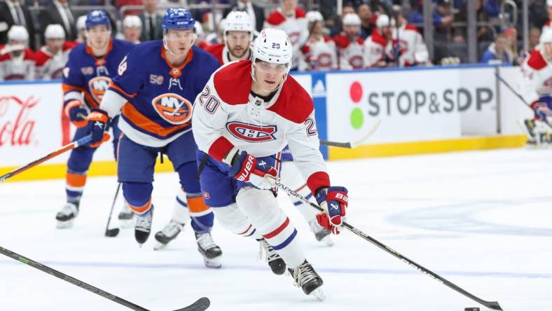 Jan 14, 2023; Elmont, New York, USA;  Montreal Canadiens left wing Juraj Slafkovsky (20) moves the puck against the New York Islanders during the first period at UBS Arena. Mandatory Credit: Thomas Salus-USA TODAY Sports