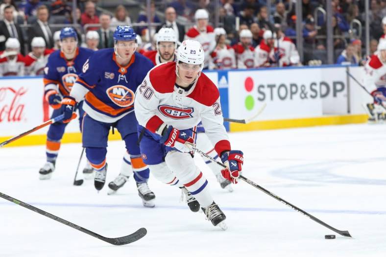 Jan 14, 2023; Elmont, New York, USA;  Montreal Canadiens left wing Juraj Slafkovsky (20) moves the puck against the New York Islanders during the first period at UBS Arena. Mandatory Credit: Thomas Salus-USA TODAY Sports
