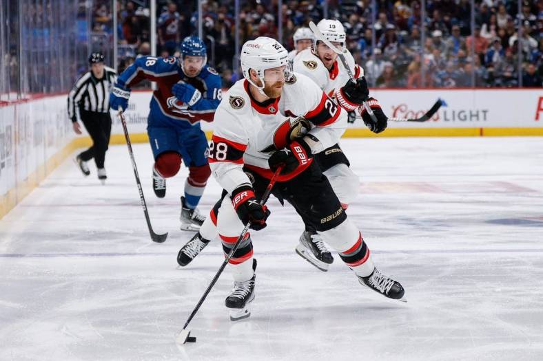 Jan 14, 2023; Denver, Colorado, USA; Ottawa Senators right wing Claude Giroux (28) controls the puck in the first period against the Colorado Avalanche at Ball Arena. Mandatory Credit: Isaiah J. Downing-USA TODAY Sports