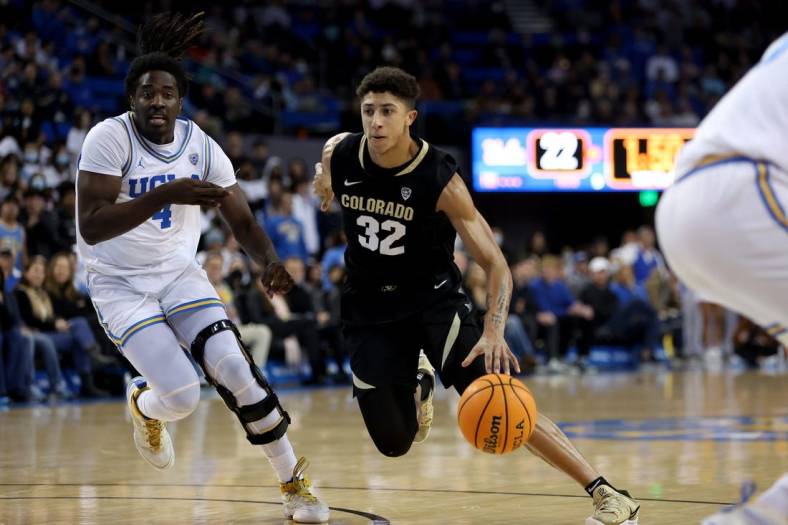 Jan 14, 2023; Los Angeles, California, USA;  Colorado Buffaloes guard Nique Clifford (32) dribbles the ball against UCLA Bruins guard Will McClendon (4) during the first half at Pauley Pavilion presented by Wescom. Mandatory Credit: Kiyoshi Mio-USA TODAY Sports