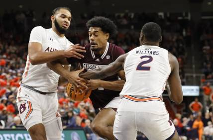 Jan 14, 2023; Auburn, Alabama, USA;  Auburn Tigers forwards Johni Broome (4) and Auburn Jaylin Williams (2) strip the ball from Mississippi State Bulldogs forward Tolu Smith (1) during the first half at Neville Arena. Mandatory Credit: John Reed-USA TODAY Sports