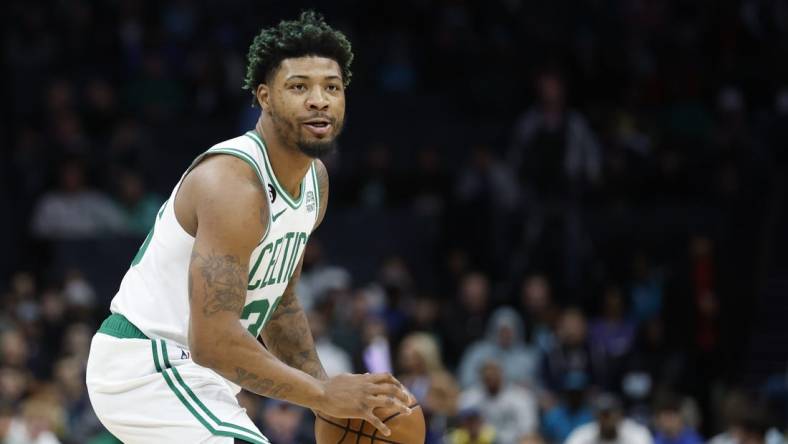 Jan 14, 2023; Charlotte, North Carolina, USA; Boston Celtics guard Marcus Smart (36) looks to pass against the Charlotte Hornets during the first half at Spectrum Center. The Boston Celtics won 122-106. Mandatory Credit: Nell Redmond-USA TODAY Sports