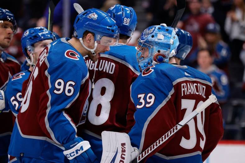 Jan 14, 2023; Denver, Colorado, USA; Colorado Avalanche right wing Mikko Rantanen (96) celebrates with goaltender Pavel Francouz (39) after the game against the Ottawa Senators at Ball Arena. Mandatory Credit: Isaiah J. Downing-USA TODAY Sports