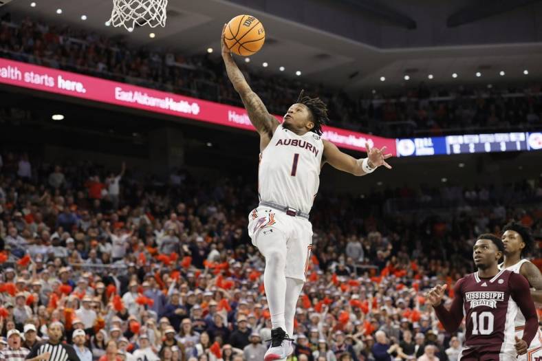 Jan 14, 2023; Auburn, Alabama, USA;  Auburn Tigers guard Wendell Green Jr. (1) goes for a layup against the Mississippi State Bulldogs during the second half at Neville Arena. Mandatory Credit: John Reed-USA TODAY Sports