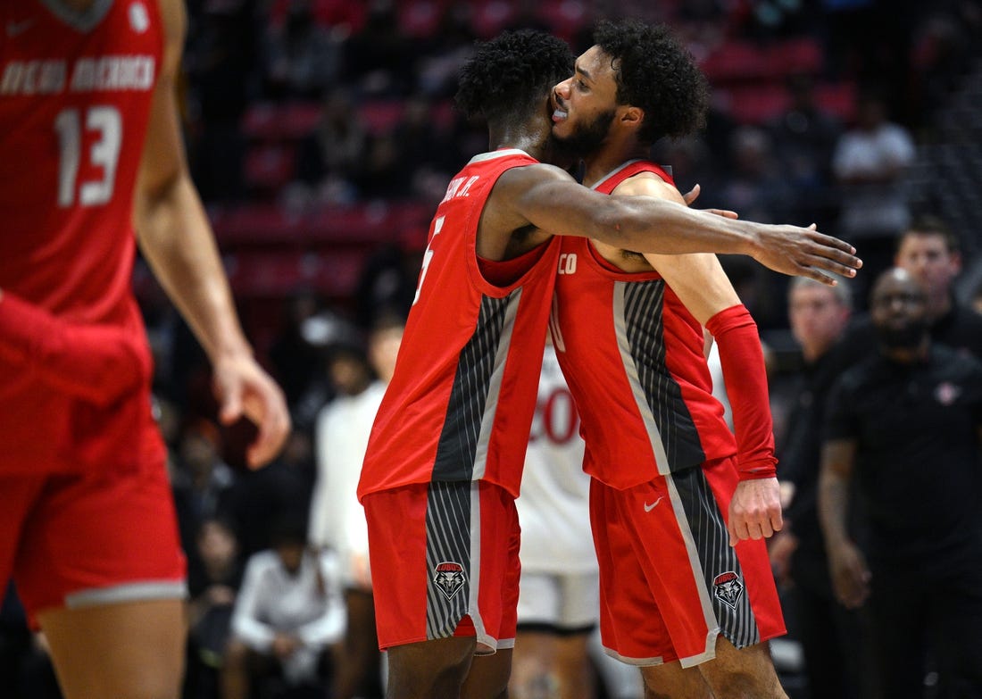 Jan 14, 2023; San Diego, California, USA; New Mexico Lobos guard Jaelen House (10) celebrates with guard Jamal Mashburn Jr. (5) after defeating the San Diego State Aztecs at Viejas Arena. Mandatory Credit: Orlando Ramirez-USA TODAY Sports