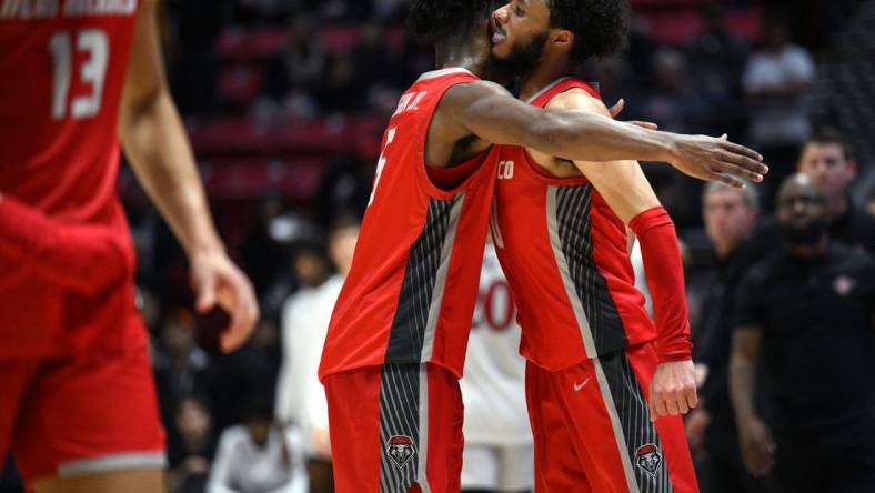 Jan 14, 2023; San Diego, California, USA; New Mexico Lobos guard Jaelen House (10) celebrates with guard Jamal Mashburn Jr. (5) after defeating the San Diego State Aztecs at Viejas Arena. Mandatory Credit: Orlando Ramirez-USA TODAY Sports