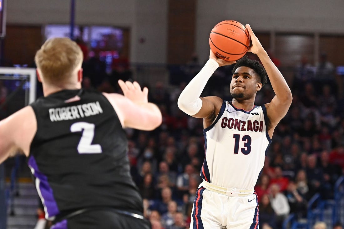 Jan 14, 2023; Spokane, Washington, USA; Gonzaga Bulldogs guard Malachi Smith (13) shoots the ball against Portland Pilots guard Tyler Robertson (2) in the second half at McCarthey Athletic Center. Mandatory Credit: James Snook-USA TODAY Sports