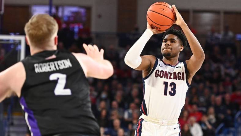 Jan 14, 2023; Spokane, Washington, USA; Gonzaga Bulldogs guard Malachi Smith (13) shoots the ball against Portland Pilots guard Tyler Robertson (2) in the second half at McCarthey Athletic Center. Mandatory Credit: James Snook-USA TODAY Sports