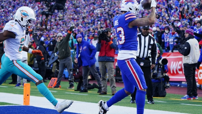 Jan 15, 2023; Orchard Park, NY, USA; Buffalo Bills wide receiver Gabe Davis (13) catches a touchdown pass against the Miami Dolphins during the second half in a NFL wild card game at Highmark Stadium. Mandatory Credit: Gregory Fisher-USA TODAY Sports