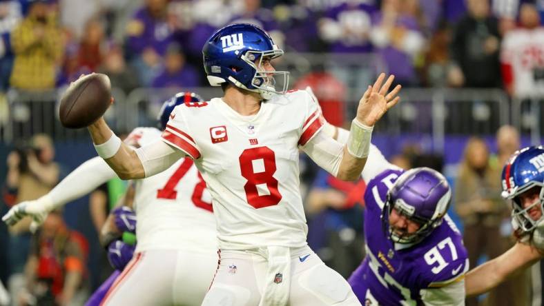 Jan 15, 2023; Minneapolis, Minnesota, USA; New York Giants quarterback Daniel Jones (8) passes the ball against the Minnesota Vikings during the first quarter of a wild card game at U.S. Bank Stadium. Mandatory Credit: Matt Krohn-USA TODAY Sports