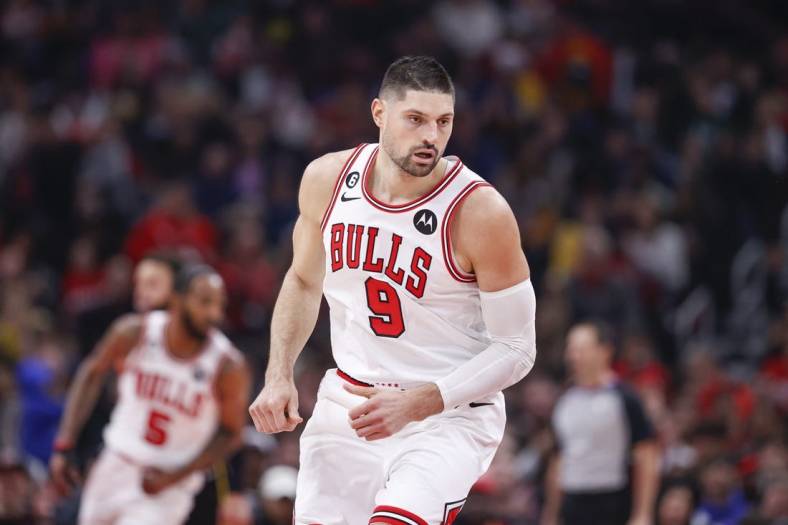 Jan 15, 2023; Chicago, Illinois, USA; Chicago Bulls center Nikola Vucevic (9) reacts after scoring against the Golden State Warriors during the first half at United Center. Mandatory Credit: Kamil Krzaczynski-USA TODAY Sports