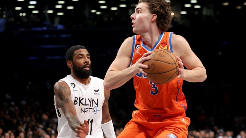 Jan 15, 2023; Brooklyn, New York, USA; Oklahoma City Thunder guard Josh Giddey (3) drives to the basket against Brooklyn Nets guard Kyrie Irving (11) during the fourth quarter at Barclays Center. Mandatory Credit: Brad Penner-USA TODAY Sports