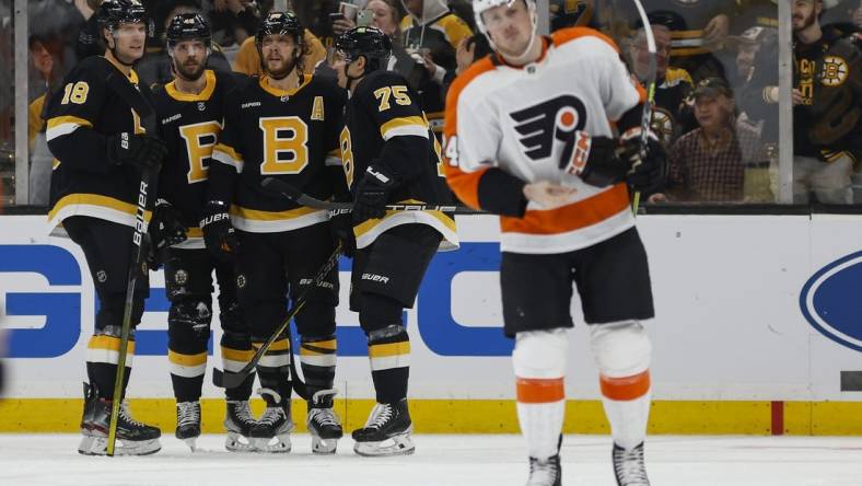 Jan 16, 2023; Boston, Massachusetts, USA; Boston Bruins center Pavel Zacha (18) is congratulated by teammates David Krejci, David Pastrnak and defenseman Connor Clifton (75) after he scored as Philadelphia Flyers defenseman Nick Seeler (24) skates away during the second period at TD Garden. Mandatory Credit: Winslow Townson-USA TODAY Sports