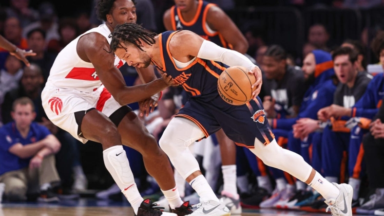 Jan 16, 2023; New York, New York, USA; New York Knicks guard Jalen Brunson (11) dribbles against Toronto Raptors forward O.G. Anunoby (3) during the first quarter at Madison Square Garden. Mandatory Credit: Vincent Carchietta-USA TODAY Sports