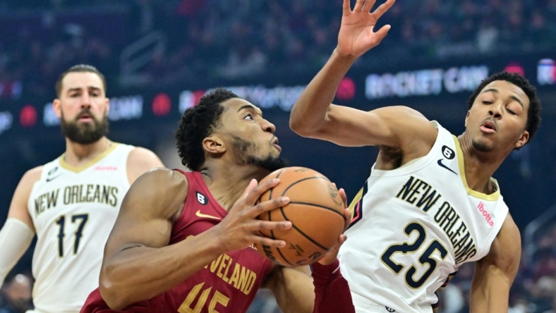 Jan 16, 2023; Cleveland, Ohio, USA; Cleveland Cavaliers guard Donovan Mitchell (45) drives to the basket against New Orleans Pelicans guard Trey Murphy III (25) at Rocket Mortgage FieldHouse. Mandatory Credit: Ken Blaze-USA TODAY Sports