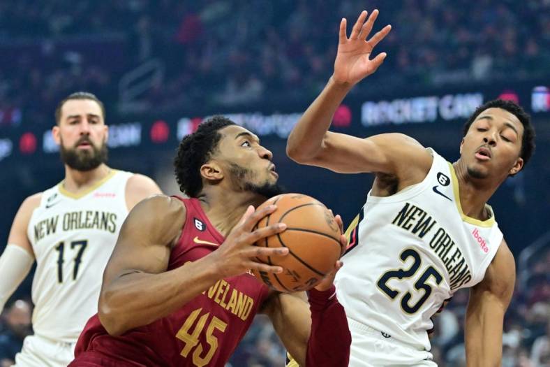 Jan 16, 2023; Cleveland, Ohio, USA; Cleveland Cavaliers guard Donovan Mitchell (45) drives to the basket against New Orleans Pelicans guard Trey Murphy III (25) at Rocket Mortgage FieldHouse. Mandatory Credit: Ken Blaze-USA TODAY Sports