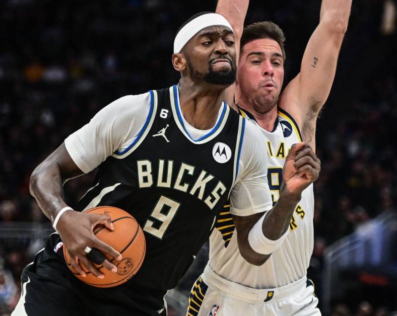 Jan 16, 2023; Milwaukee, Wisconsin, USA; Milwaukee Bucks forward Bobby Portis (9) drives for the basket against Indiana Pacers guard T.J. McConnell (9) in the second quarter at Fiserv Forum. Mandatory Credit: Benny Sieu-USA TODAY Sports