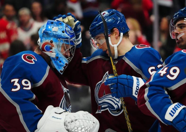 Jan 16, 2023; Denver, Colorado, USA; Colorado Avalanche goaltender Pavel Francouz (39) and left wing Artturi Lehkonen (62) celebrate the win over against the Detroit Red Wings at Ball Arena. Mandatory Credit: Ron Chenoy-USA TODAY Sports