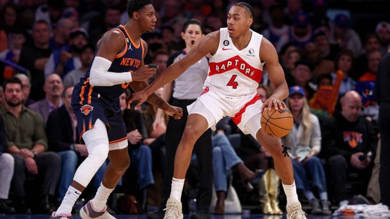 Jan 16, 2023; New York, New York, USA; Toronto Raptors forward Scottie Barnes (4) dribbles against New York Knicks guard RJ Barrett (9) during the second half at Madison Square Garden. Mandatory Credit: Vincent Carchietta-USA TODAY Sports