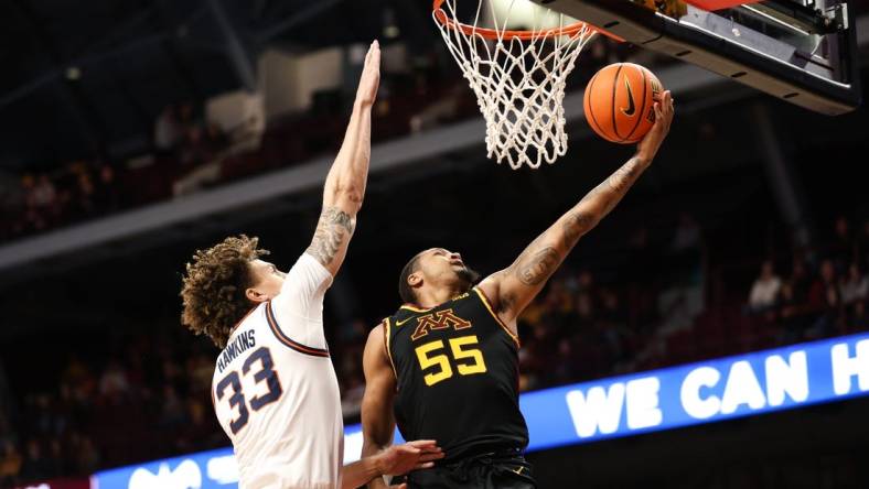 Jan 16, 2023; Minneapolis, Minnesota, USA; Minnesota Golden Gophers guard Ta'lon Cooper (55) shoots while Illinois Fighting Illini forward Coleman Hawkins (33) defends during the first half at Williams Arena. Mandatory Credit: Matt Krohn-USA TODAY Sports