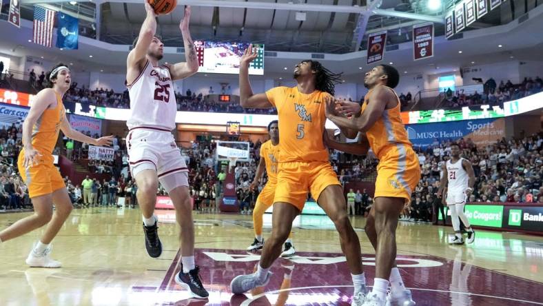 Jan 16, 2023; Charleston, South Carolina, USA; Charleston Cougars forward Ben Burnham (25) shoots the ball in the second half over William & Mary Tribe forward Noah Collier (5) at TD Arena. Mandatory Credit: David Yeazell-USA TODAY Sports