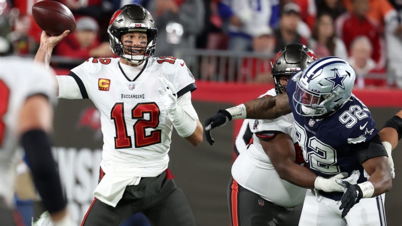 Jan 16, 2023; Tampa, Florida, USA; Tampa Bay Buccaneers quarterback Tom Brady (12) drops back to pass against the Dallas Cowboys in the first half during the wild card game at Raymond James Stadium. Mandatory Credit: Kim Klement-USA TODAY Sports