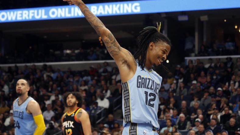 Jan 16, 2023; Memphis, Tennessee, USA; Memphis Grizzlies guard Ja Morant (12) reacts during the second half against the Phoenix Suns at FedExForum. Mandatory Credit: Petre Thomas-USA TODAY Sports