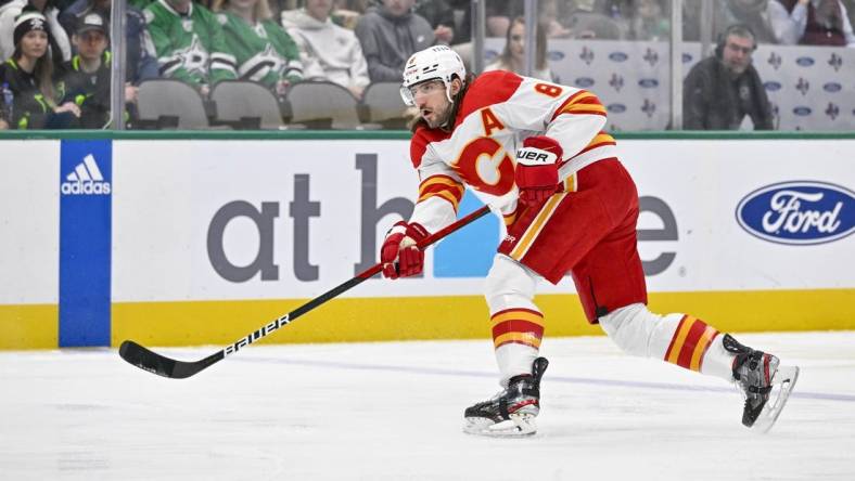 Jan 14, 2023; Dallas, Texas, USA; Calgary Flames defenseman Chris Tanev (8) in action during the game between the Dallas Stars and the Calgary Flames at American Airlines Center. Mandatory Credit: Jerome Miron-USA TODAY Sports