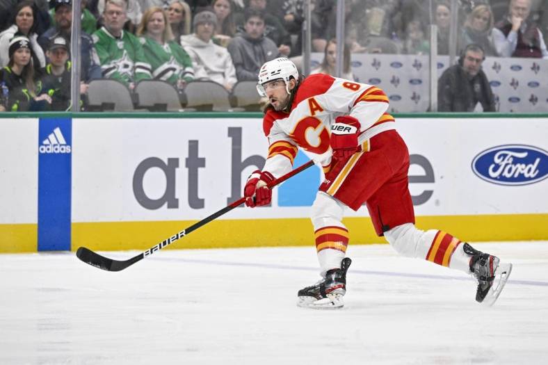 Jan 14, 2023; Dallas, Texas, USA; Calgary Flames defenseman Chris Tanev (8) in action during the game between the Dallas Stars and the Calgary Flames at American Airlines Center. Mandatory Credit: Jerome Miron-USA TODAY Sports