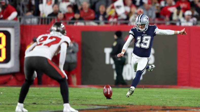 Jan 16, 2023; Tampa, Florida, USA; Dallas Cowboys place kicker Brett Maher (19) kicks the ball to the Tampa Bay Buccaneers in the first half during the wild card game at Raymond James Stadium. Mandatory Credit: Nathan Ray Seebeck-USA TODAY Sports