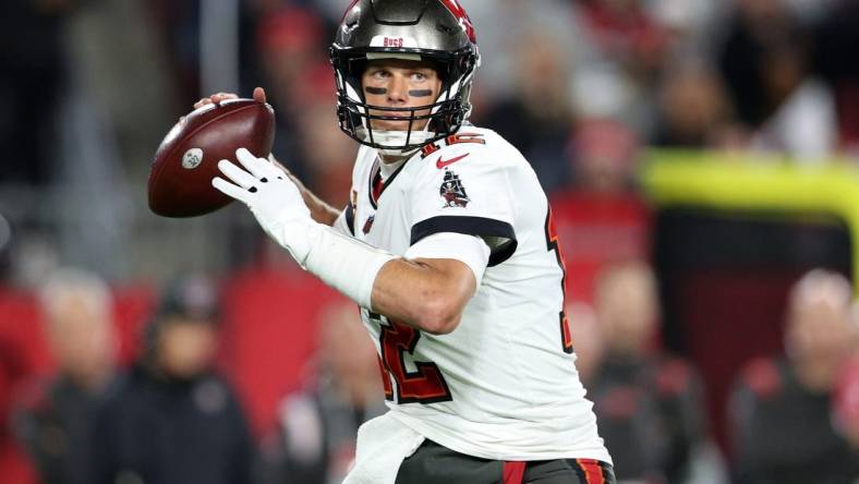 Jan 16, 2023; Tampa, Florida, USA; Tampa Bay Buccaneers quarterback Tom Brady (12) drops back to pass against the Dallas Cowboys during a wild card game at Raymond James Stadium. Mandatory Credit: Nathan Ray Seebeck-USA TODAY Sports