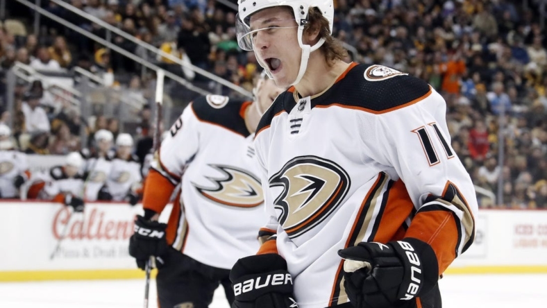 Jan 16, 2023; Pittsburgh, Pennsylvania, USA;  Anaheim Ducks center Trevor Zegras (11) reacts after scoring a goal against the Pittsburgh Penguins during the third period at PPG Paints Arena. The Penguins won 4-3 in overtime.  Mandatory Credit: Charles LeClaire-USA TODAY Sports